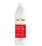 Yellow peroxide bottle with red label on a white background