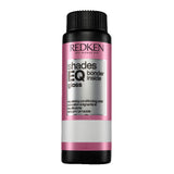 Redken Shades EQ bonder inside hair color bottle on a white background