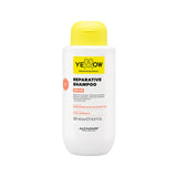 Yellow professional reparative Shampoo bottle with yellow cap and white label on a white background